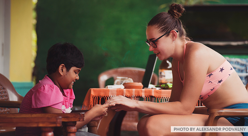 Student talking to young girl